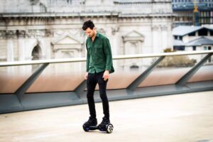 Young man on hoverboard outside