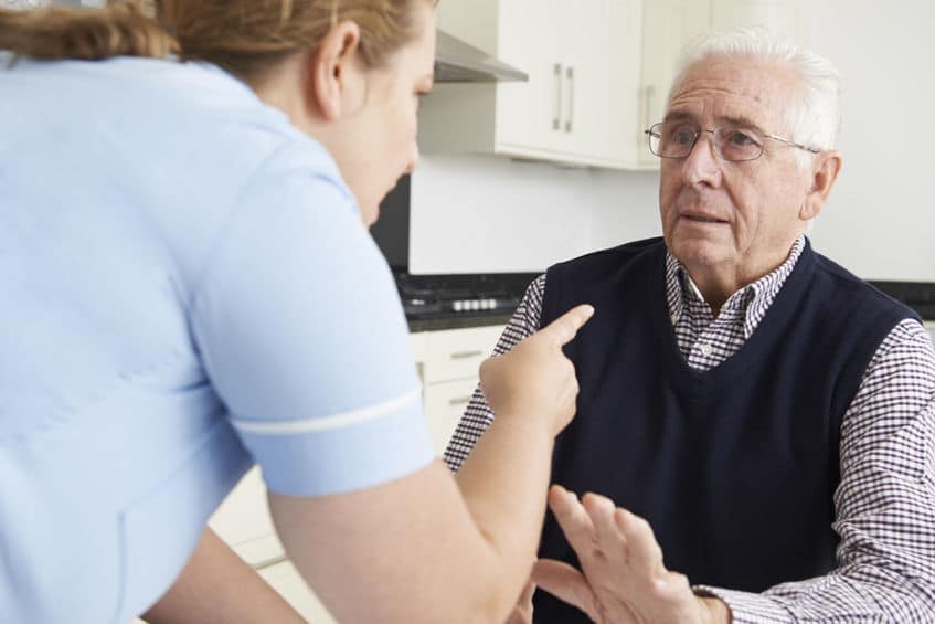 Nursing home attendant yelling at old man resident