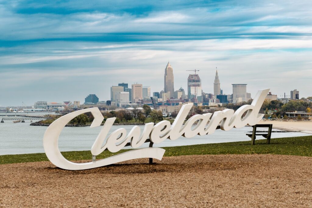 A sign of the word Cleveland overseeing the city.