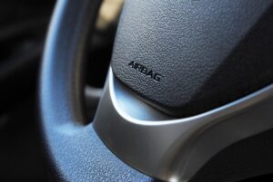 Airbag icon on steering wheel of car close up recall