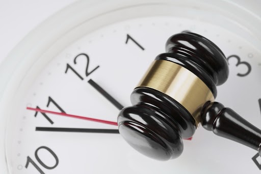 A judge's gavel resting on a clock face, symbolizing legal deadlines and the statute of limitations for personal injury claims in Ohio.
